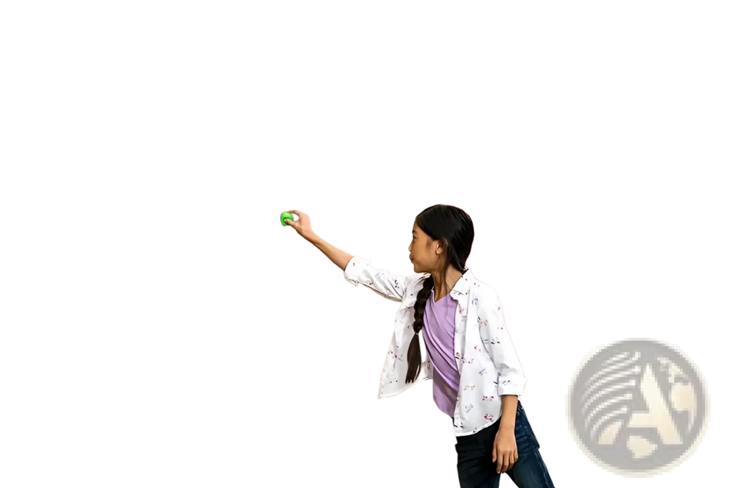 A child draws a colorful golden egg on a brick wall using chalk featuring sticky wall ball stress relief toy