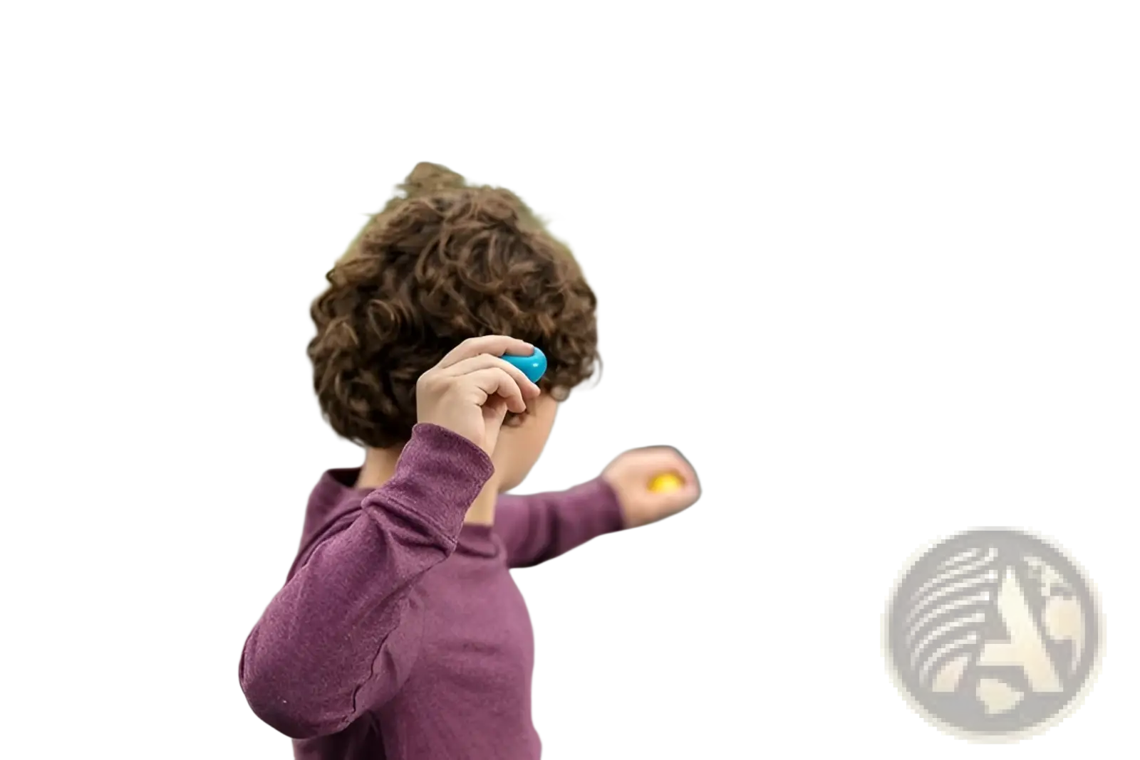 A child with curly brown hair holds a small bright blue sticky wall ball stress relief glow squash toy