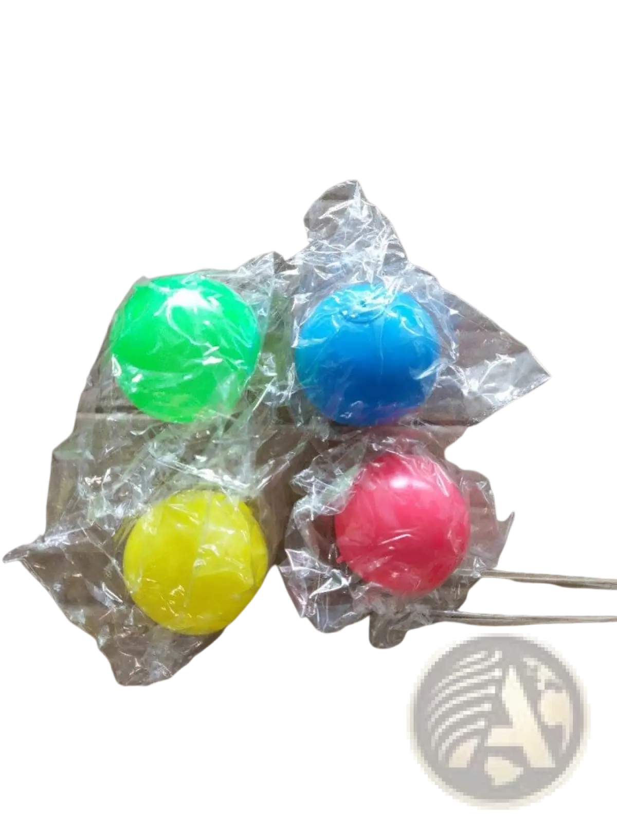 Four brightly colored plastic sticky wall ball stress relief glow squash toys individually wrapped in clear cellophane