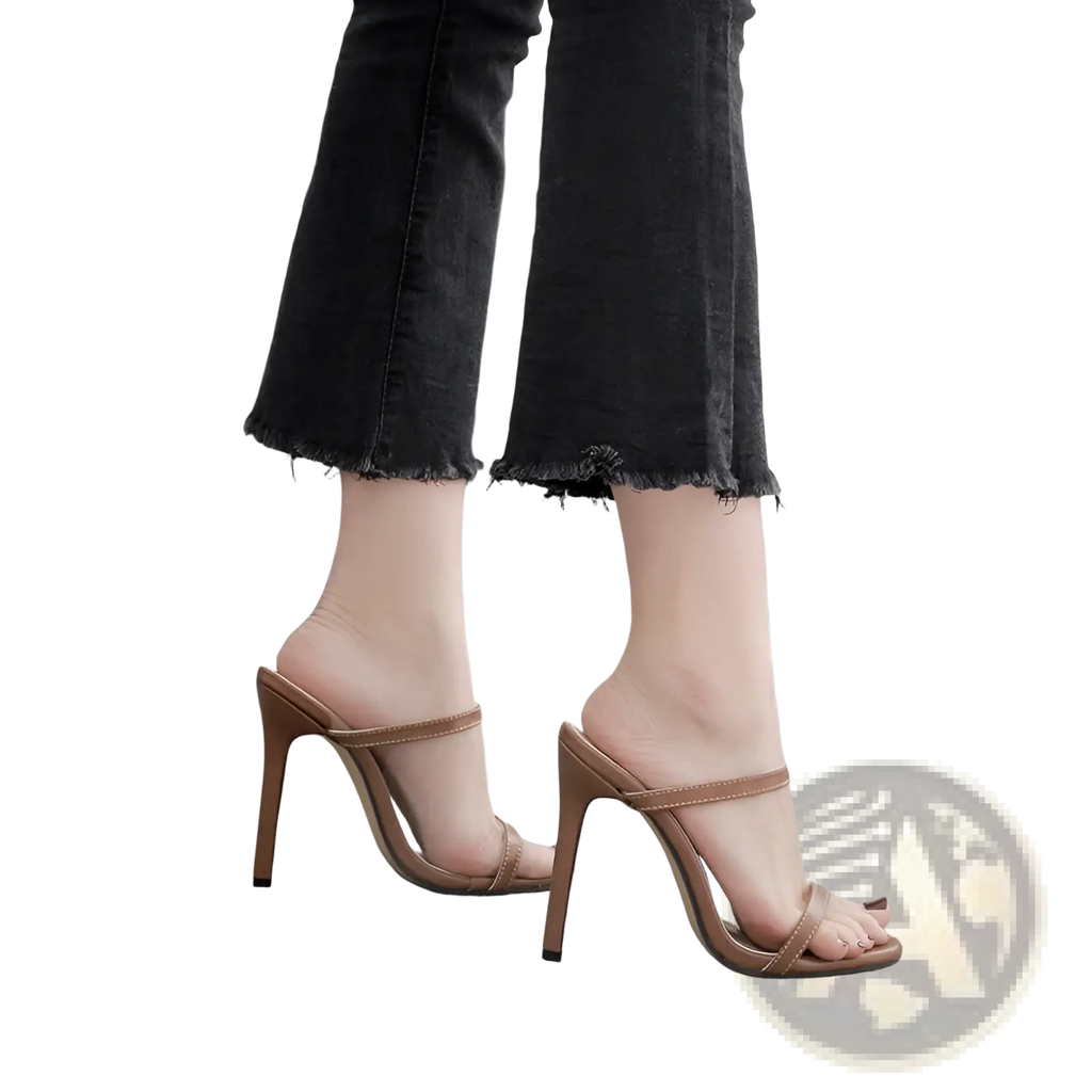 Tan leather mule sandals with minimalist straps and high stiletto heels for elegant stylish wear
