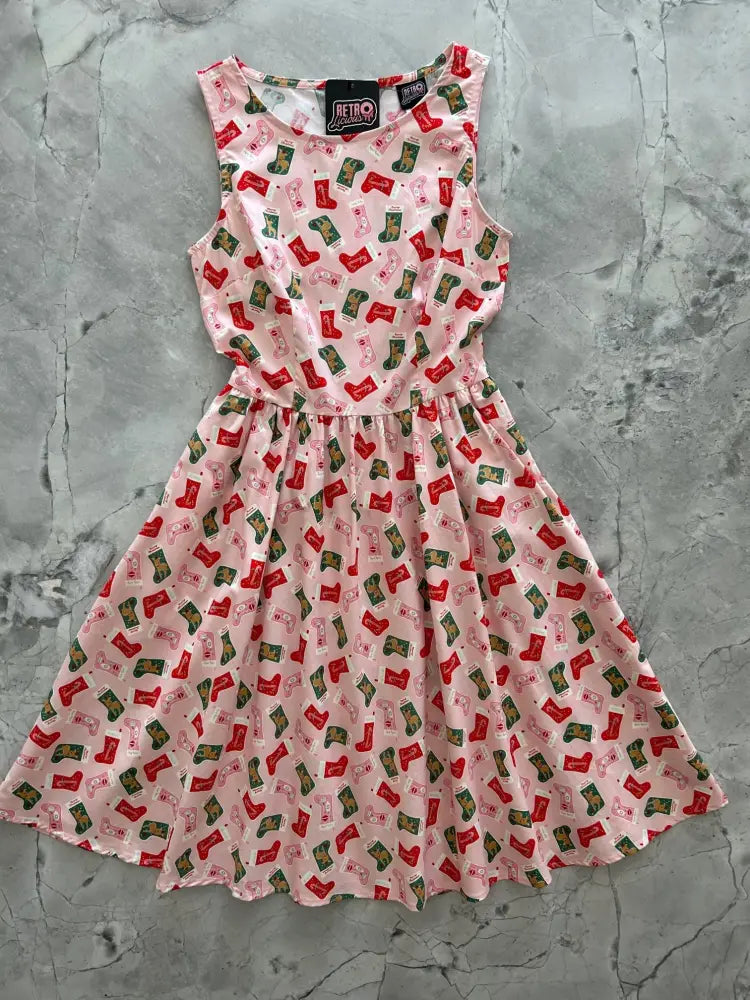 Pink Christmas stocking vintage 1950s cotton dress with fitted bodice flared skirt and red green stocking pattern