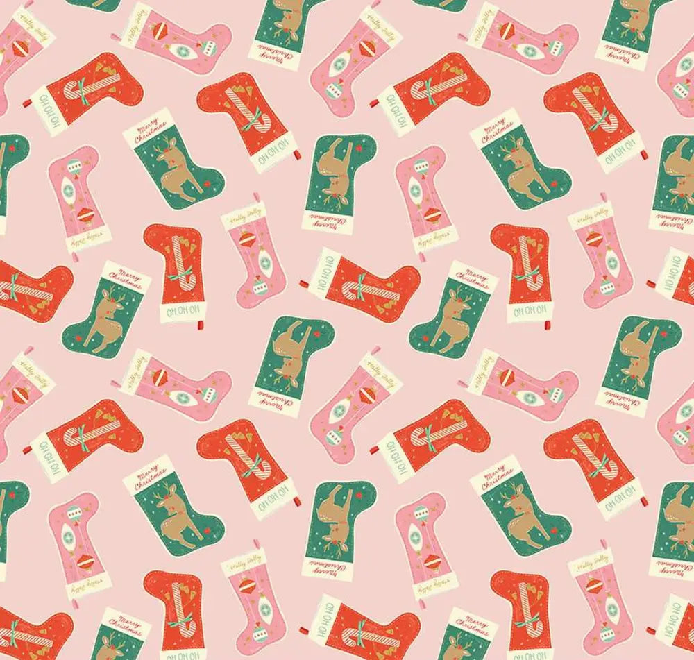 Pink christmas stocking vintage 1950s cotton dress with red and green reindeer candy cane pattern on pink background