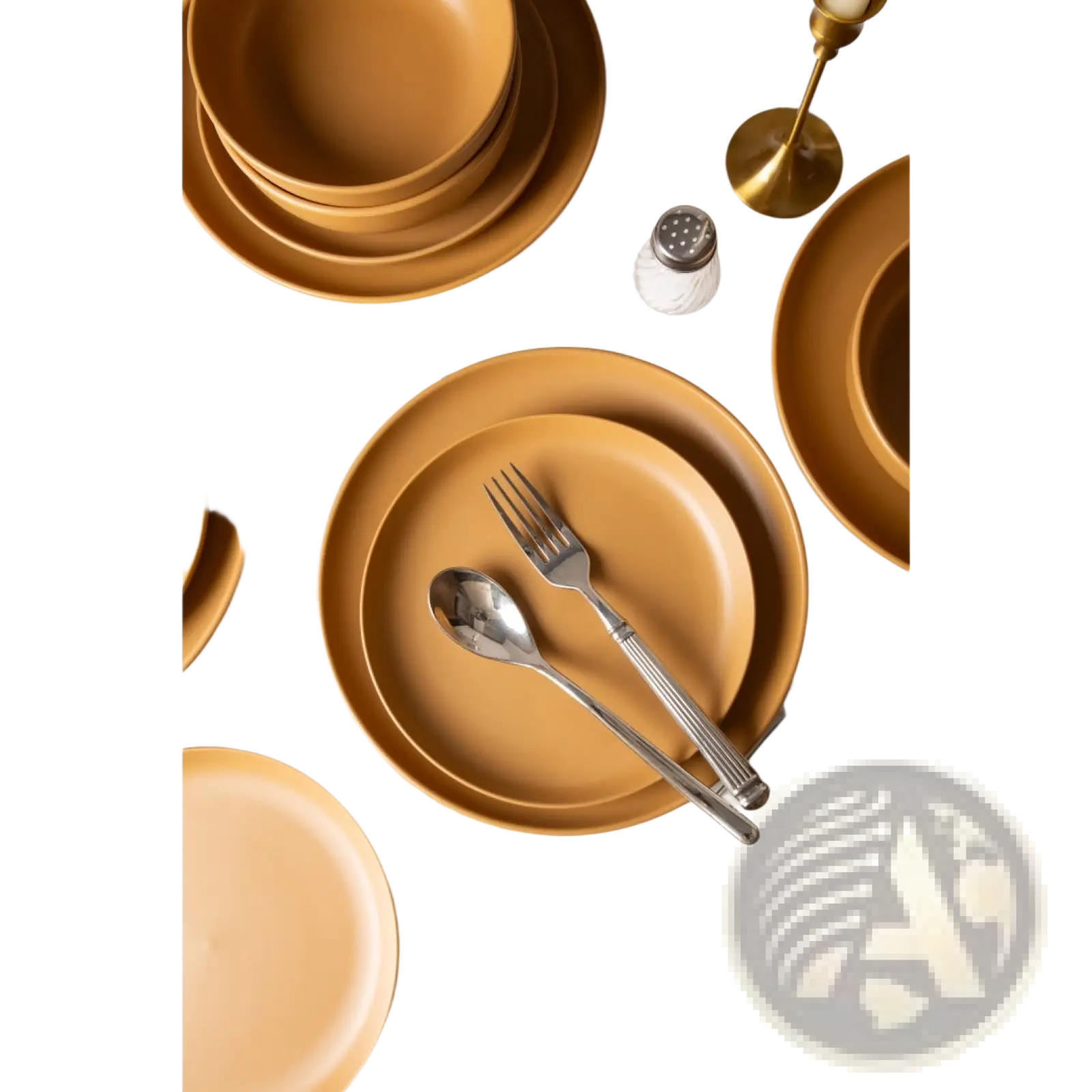 Set of 12 piece matte glaze mustard yellow stoneware dinnerware with matching plates bowls and silver cutlery for three