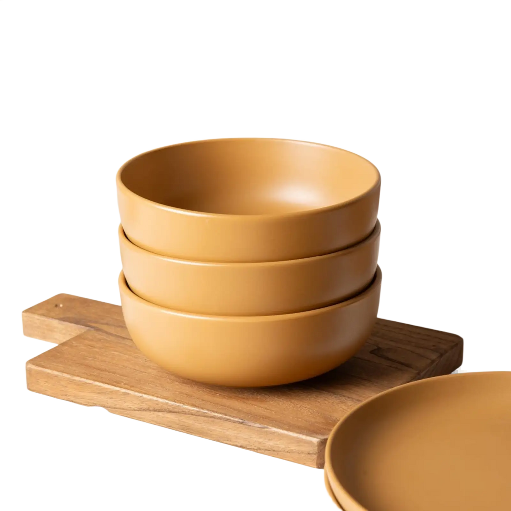 Stack of matte mustard yellow ceramic bowls from stoneware dinnerware set 12 piece matte glaze for 4 people