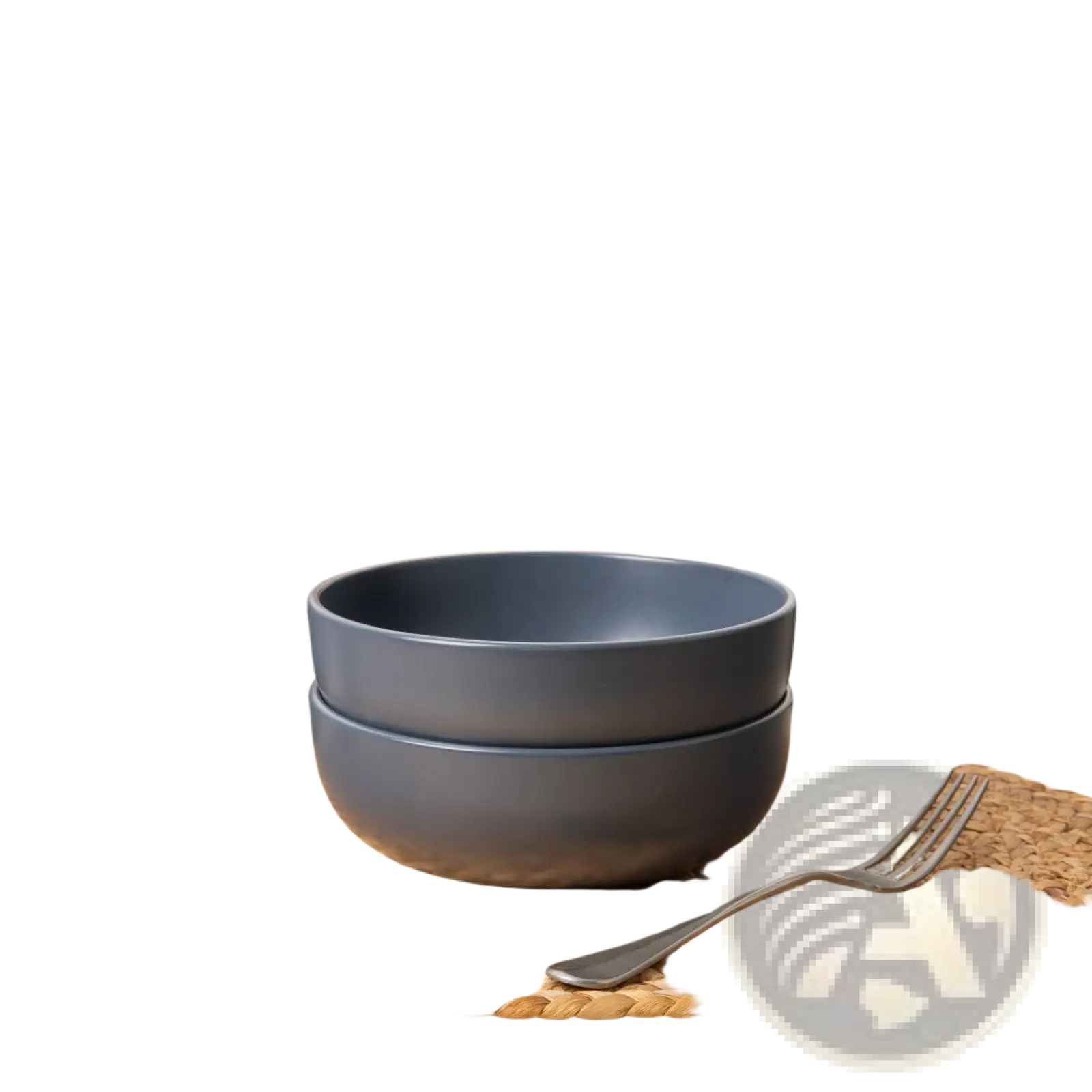 Stacked matte gray stoneware ceramic bowls with a modern minimalist design in a 12 piece dinnerware set for 4