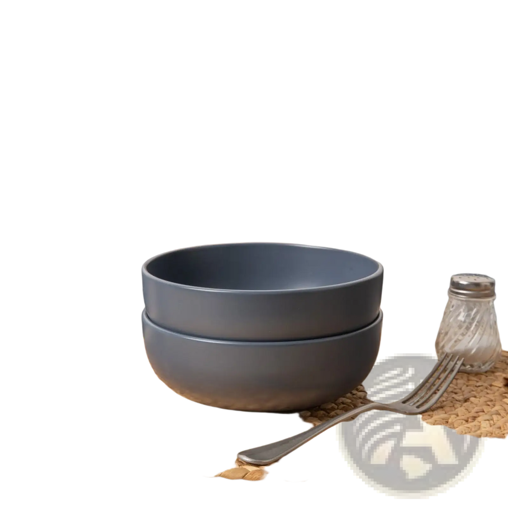 Stack of matte gray ceramic bowls from a 12 piece stoneware dinnerware set for four people