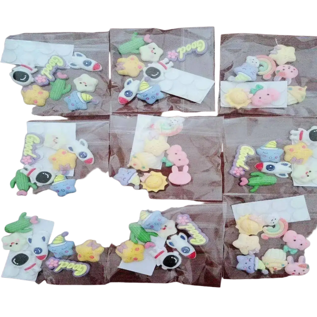 Pastel-colored silicone animal and object charms stored in a large capacity cream organizer storage box with bunny handle in modern minimalist style