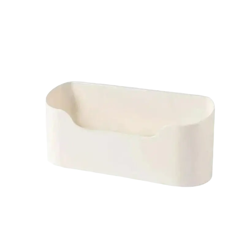 Cream-colored sleek plastic adhesive wall mounted sink organizer with rounded edges and central recessed slot storage rack feature