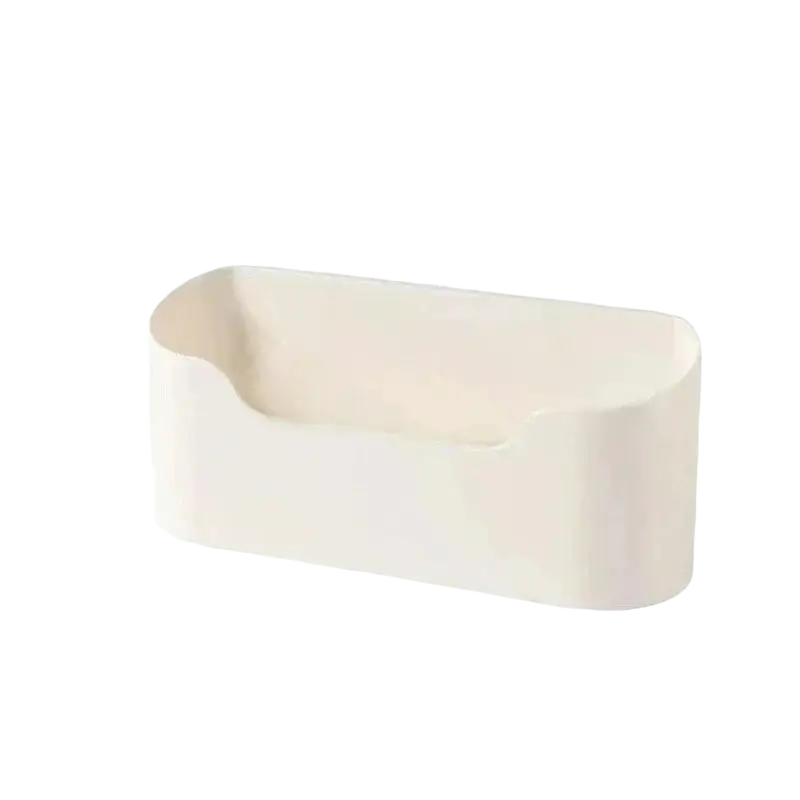 White plastic adhesive wall mounted storage rack with rounded edges and single compartment sink organizer feature