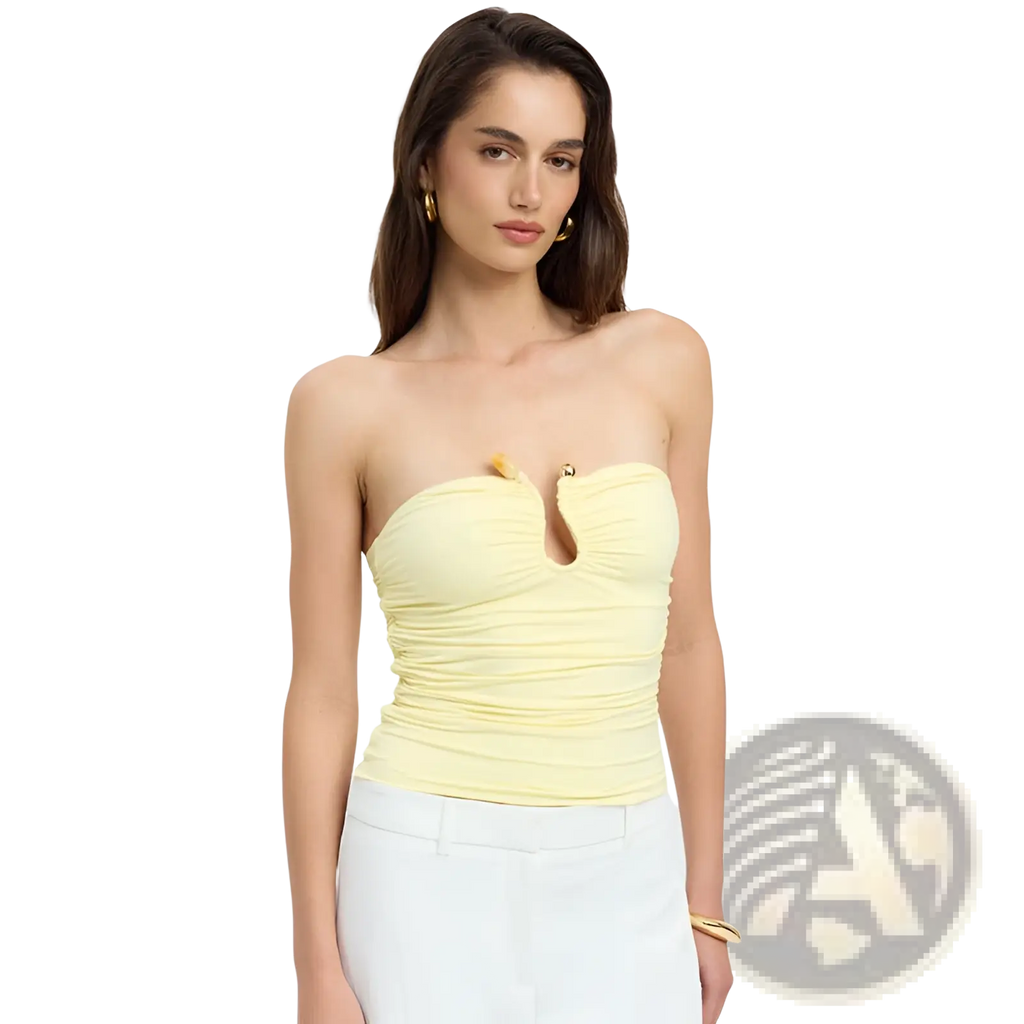 A pale yellow strapless keyhole crop top with ruched fabric and gold-tone hardware for stylish wear