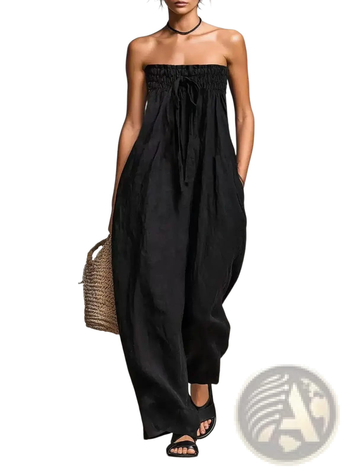 Black strapless smocked jumpsuit with gathered waist and wide-leg design for casual wear
