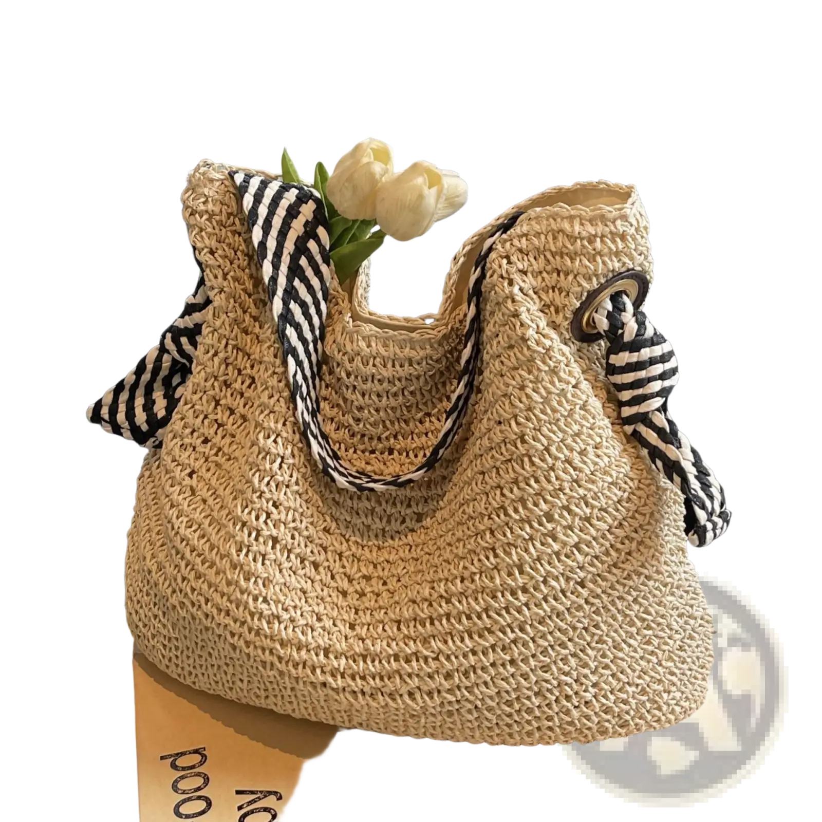 Beige woven straw tote bag with black and white striped fabric bow handles for casual use