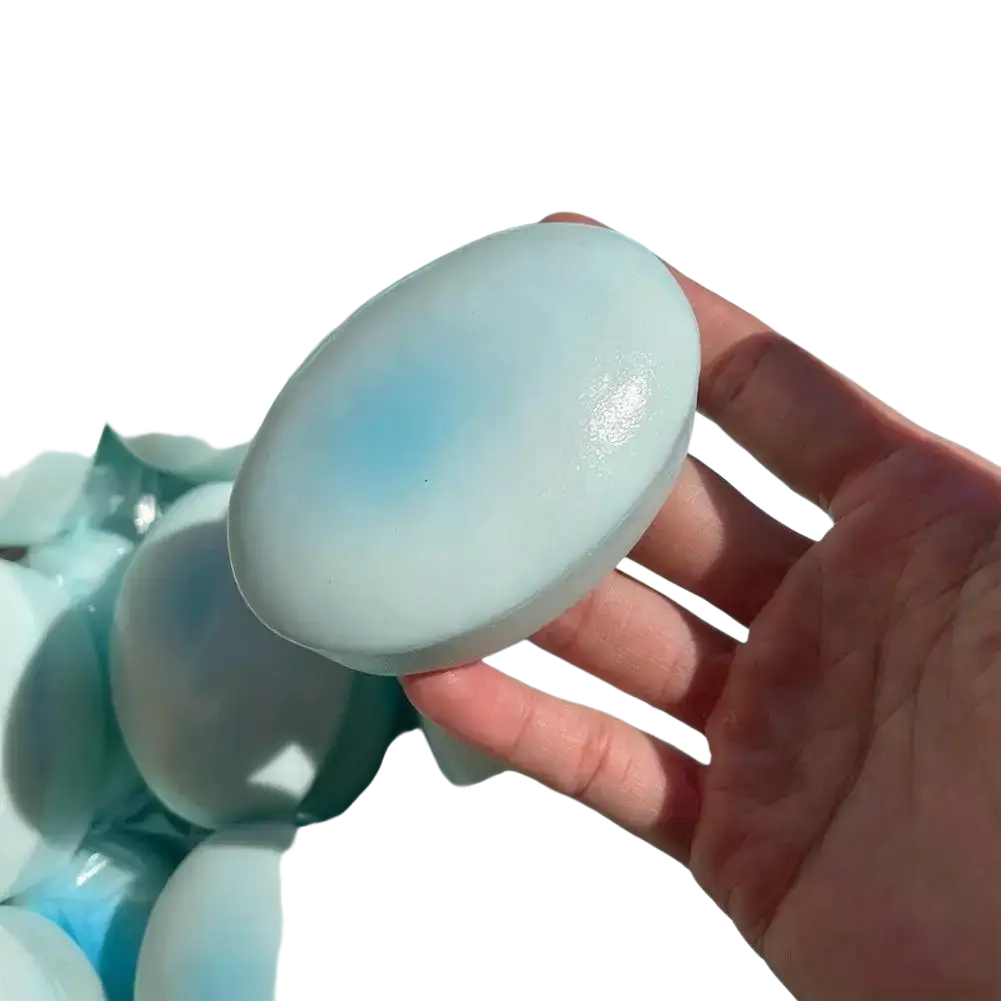 A smooth pale blue slow rising cheese cake squishy toy bar designed for stress relief with a subtle gradient top