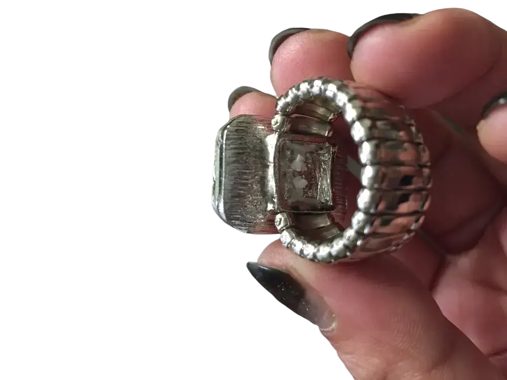 Silver-toned stretch crystal statement ring for women with a textured rectangular centerpiece and adjustable braided band