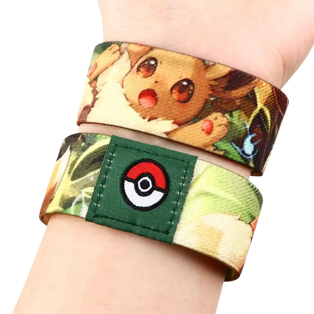 A vibrant elastic stretch wristband bracelet with pokemon eevee print and a green embroidered poké ball patch