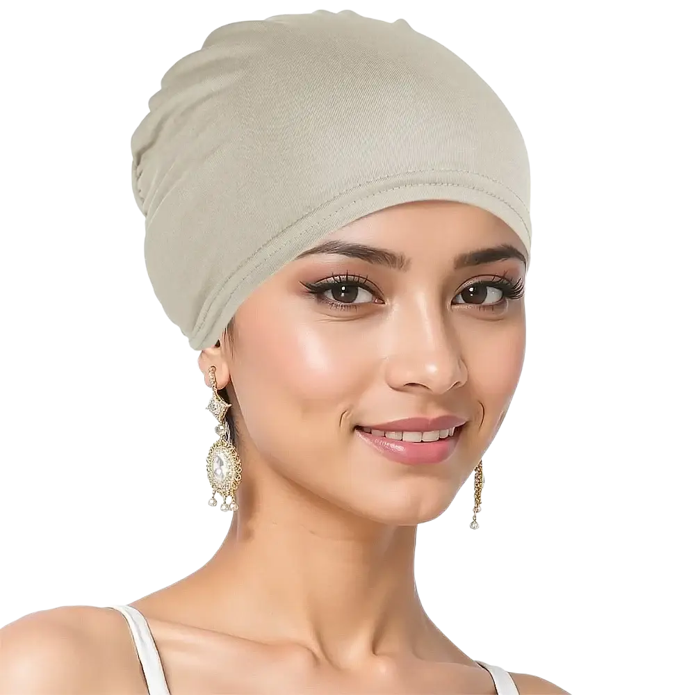 Beige stretchy jersey turban chemo hijab hat worn snugly on the head made of soft breathable fabric
