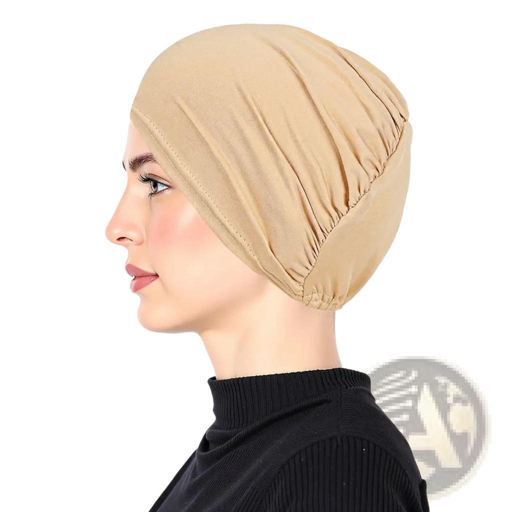 Beige stretchy jersey turban chemo hijab hat with gathered ruching and elasticated edge for comfortable wear