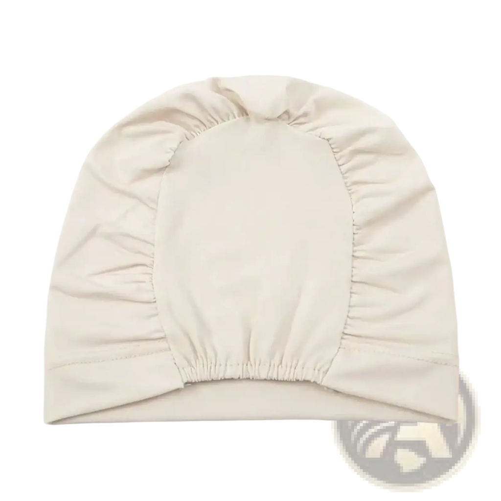 Beige stretchy jersey turban chemo hijab hat with gathered elastic edge and smooth fabric made from soft stretch material