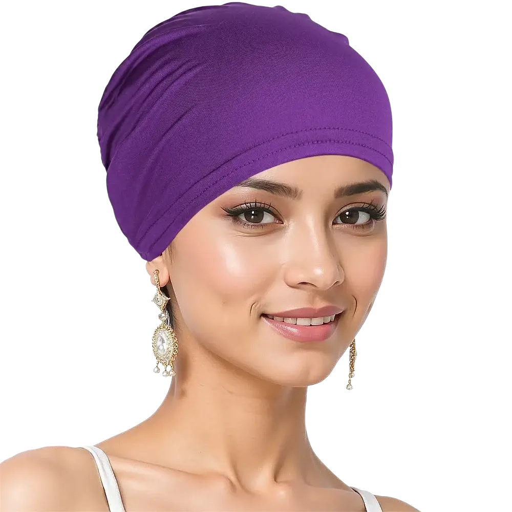 A soft solid purple stretchy jersey turban chemo hijab hat with smooth fabric and subtle stitched trim