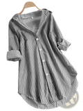 A loose-fitting long-sleeved casual button down shirt with black and white vertical stripes and rolled cuffs