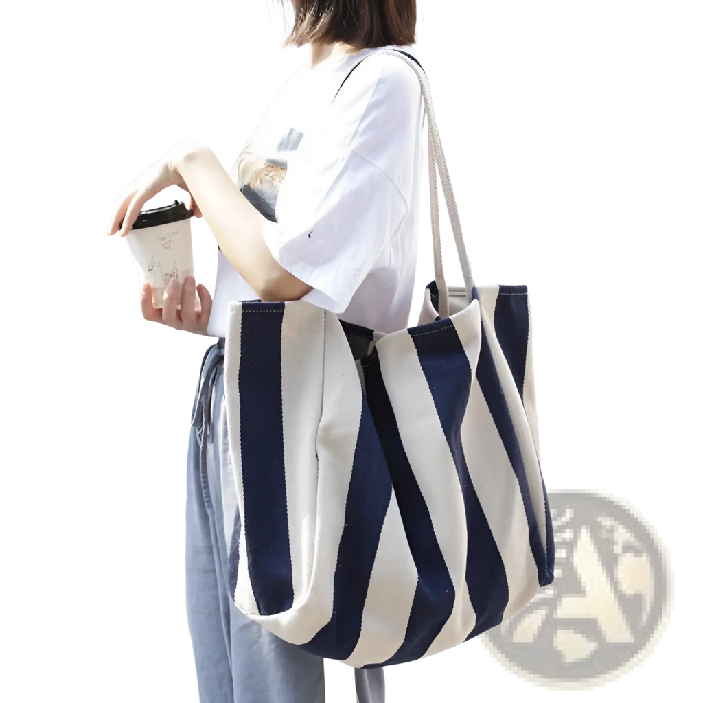 A navy and cream striped canvas tote bag with high capacity and sturdy shoulder handles for daily use