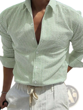 Light green and white vertically striped casual long sleeve shirt for men with a textured woven fabric