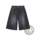 Black and white vertically striped distressed denim shorts ideal for casual summer wear