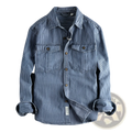 Striped denim shirt for men featuring blue and white vertical stripes, two chest pockets, and brown buttons