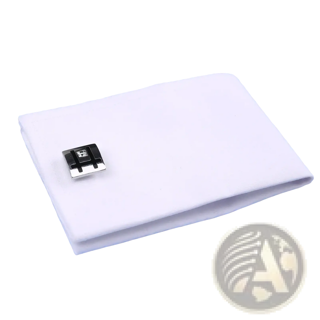 White cotton cufflinks with black and silver rectangular clasp and clear gemstone paired with striped french cuff dress shirt