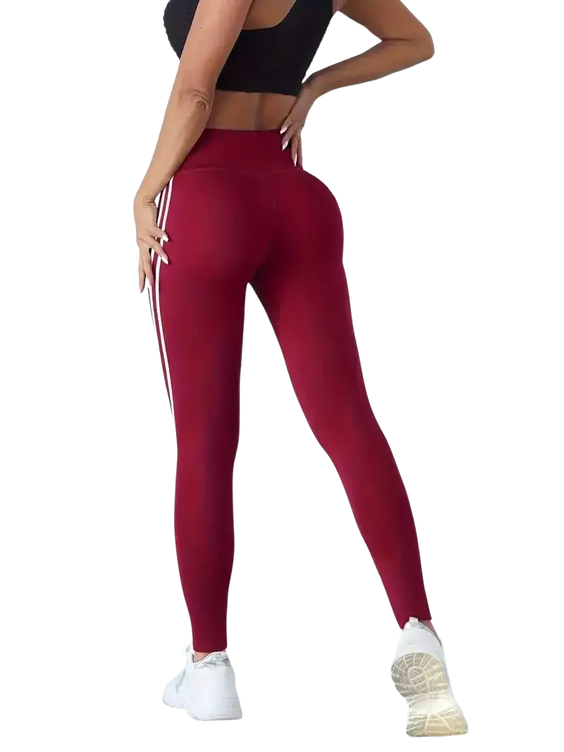 Maroon high waist yoga leggings with white side stripes designed for comfort and performance during workouts