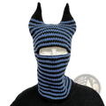 Blue and black striped knitted balaclava with pointed ear-like protrusions designed as a winter hat