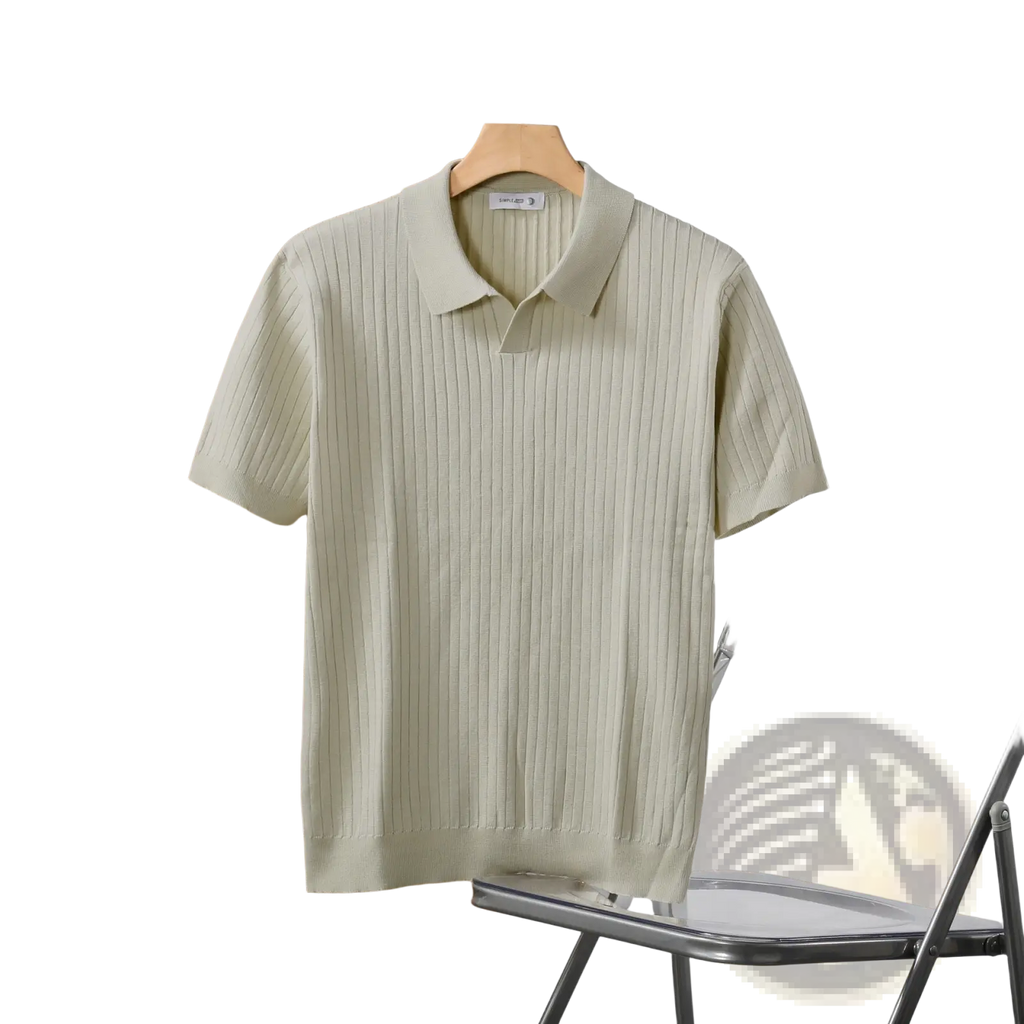 Light green striped jacquard ribbed knit polo shirt with classic collar and short sleeves hanging on wooden hanger