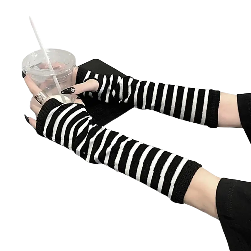 Black and white striped knit fingerless arm warmers shown from the back side made of soft wool for versatile wear