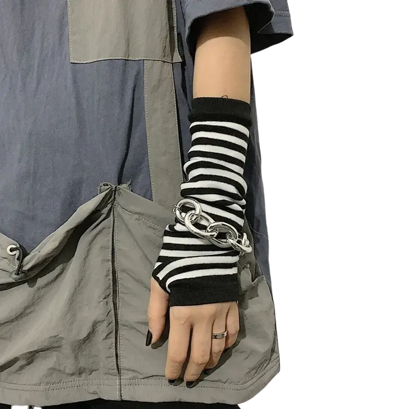 Striped knit fingerless arm warmers in black and white with a silver chain cuff detail made of soft knit material