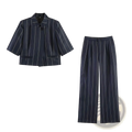 Navy blue linen blend pinstripe two-piece suit set with white vertical stripes featuring a structured blazer and wide-leg trousers
