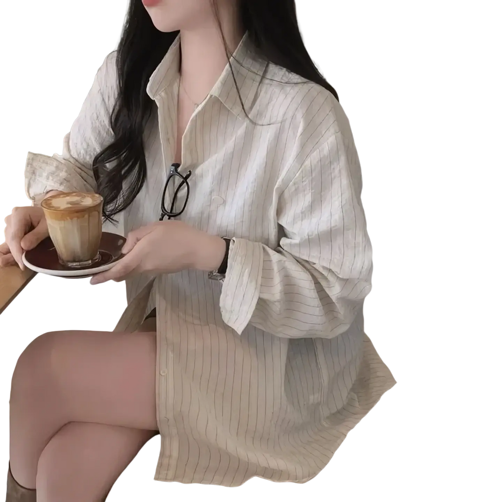 A versatile style striped long sleeve button down shirt in off-white with thin vertical stripes and standard thickness fabric