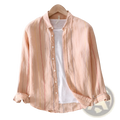 Soft peach-colored striped men linen long sleeve shirt with subtle red and blue vertical stripes in lightweight fabric