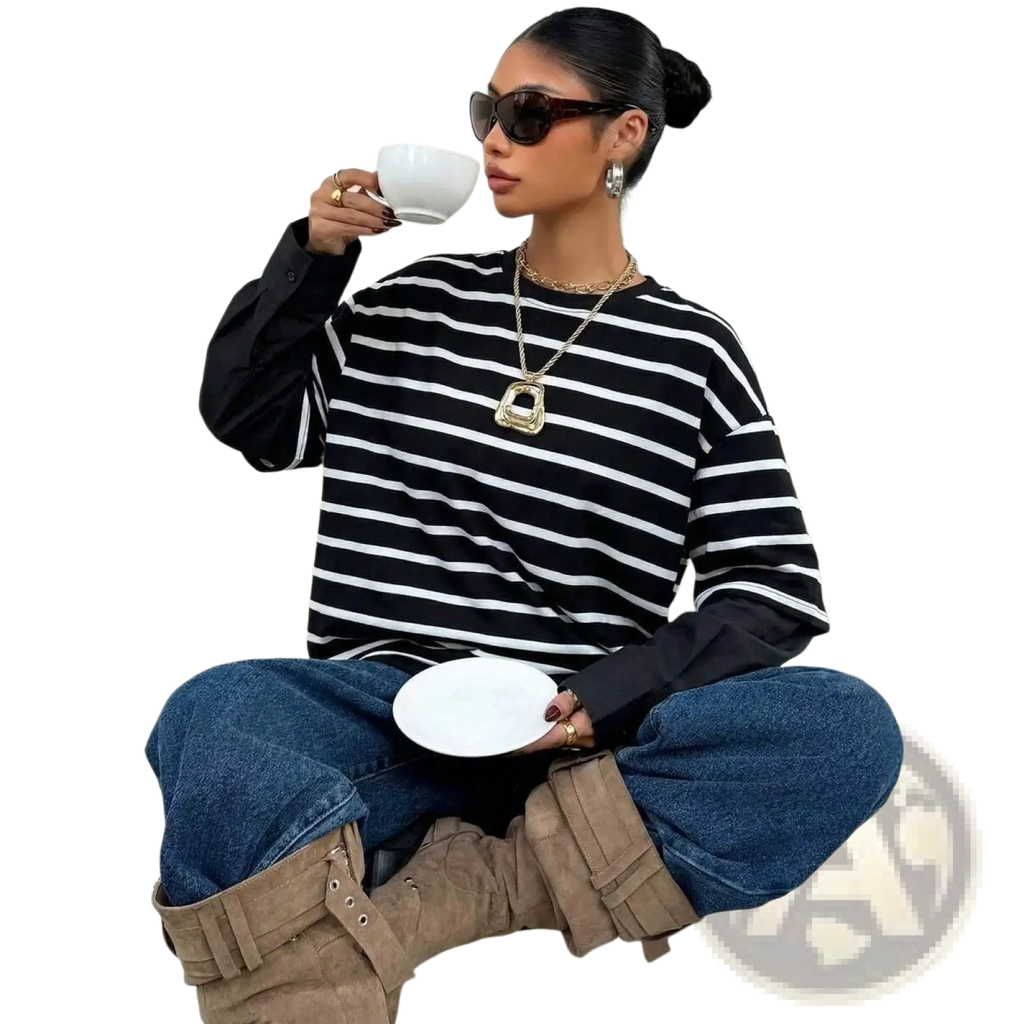 Black and white horizontally striped long-sleeved oversized hoodie with layered black inner sleeves and mock two piece design