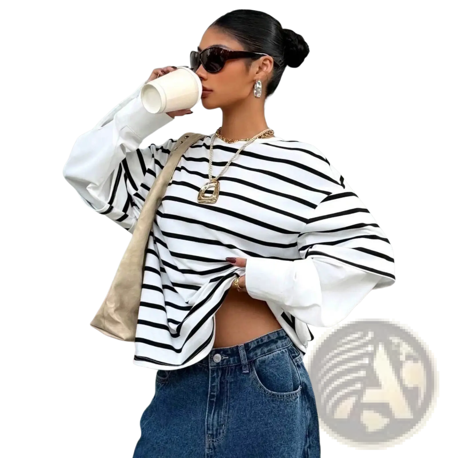A woman wearing a black and white striped long-sleeve top with balloon sleeves in a striped mock two piece oversized hoodie