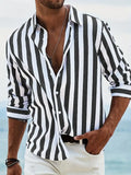 Men’s loose fit vertical striped black and white button-down long sleeve casual shirt with rolled-up sleeves