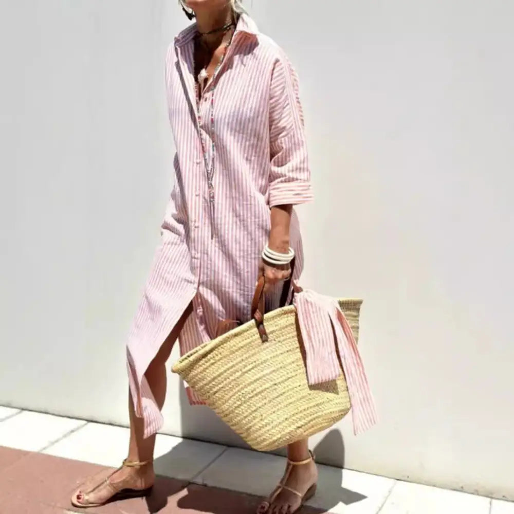 Striped linen belted lapel shirt dress in pink and white vertical stripes with long sleeves and a high low hemline