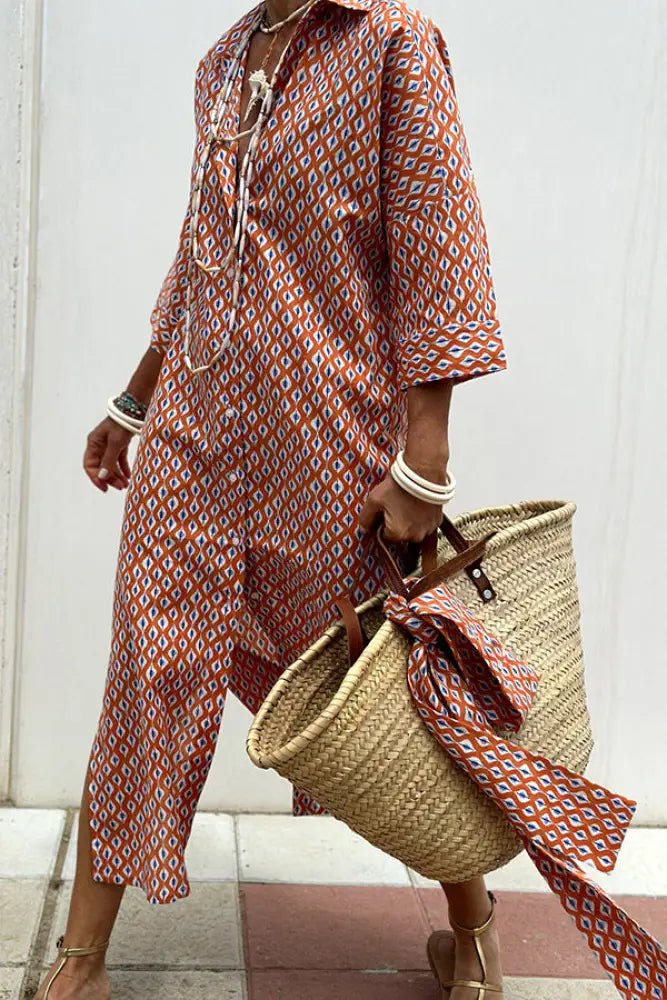 A woven straw tote bag with brown leather handles and a matching fabric tie complementing a striped linen belted lapel shirt dress