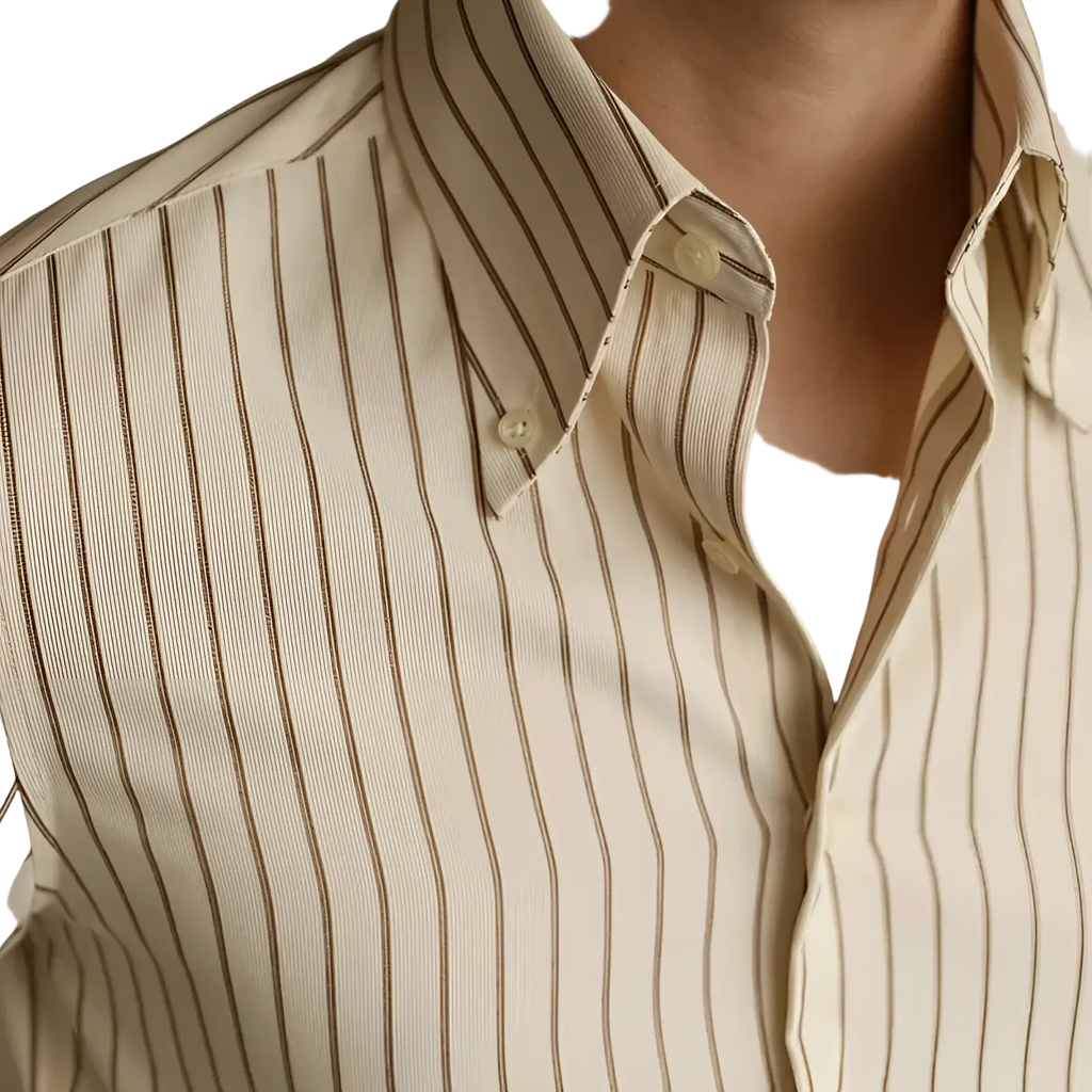 A cream-colored striped slim fit long sleeve button down shirt with thin dark brown vertical stripes and a crisp collar