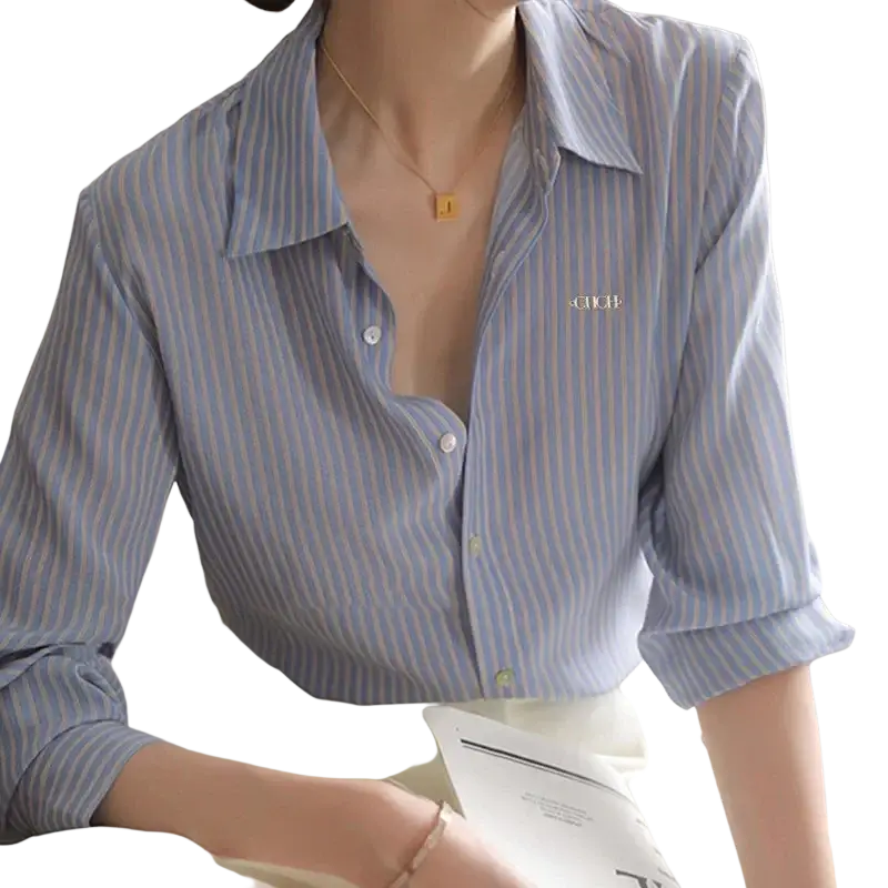 A light blue and white striped synthetic fiber women shirt with buttons and subtle embroidered logo on the left chest