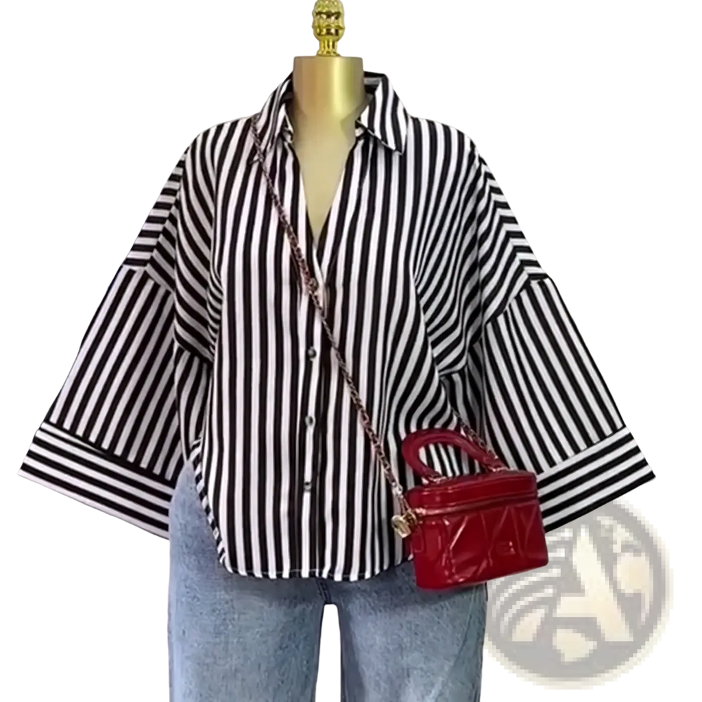 Red quilted leather handbag with gold-tone hardware and chain strap paired with striped Y2k button up blouse