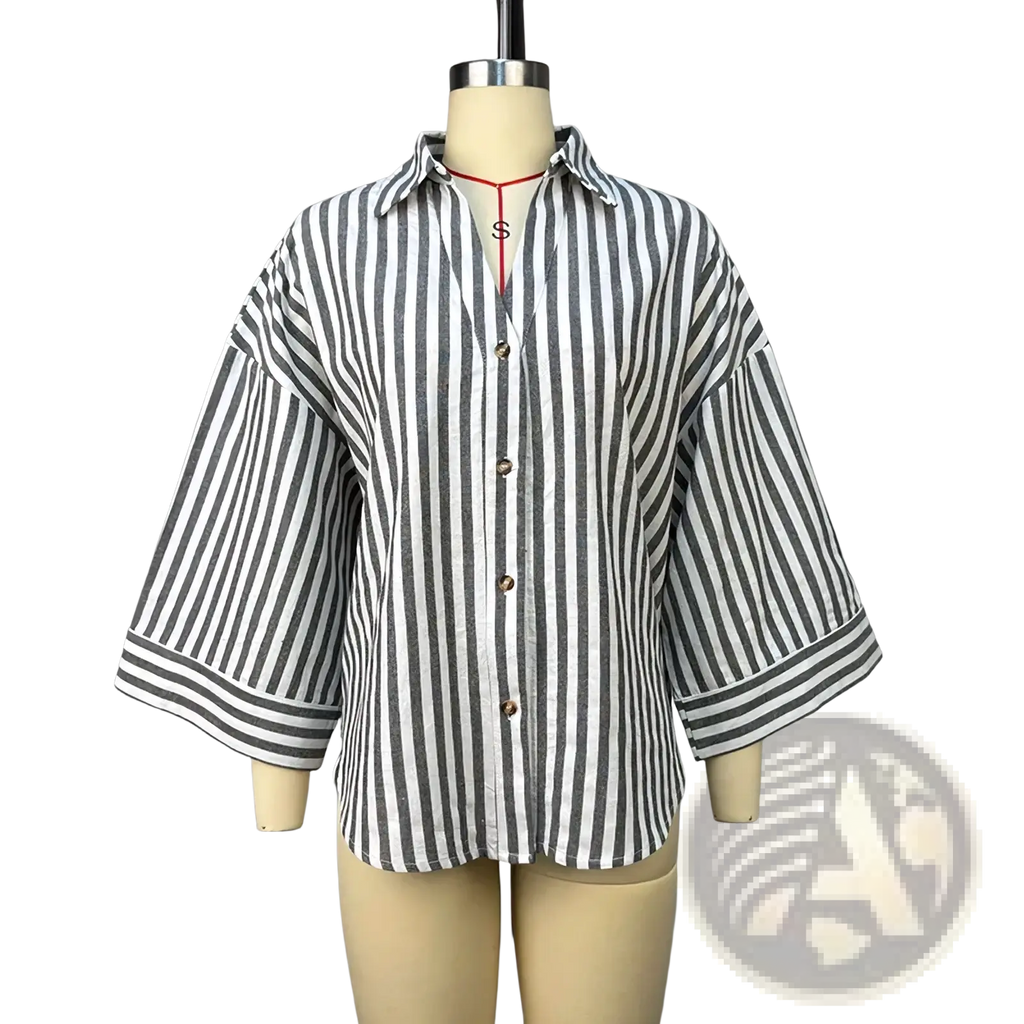 A relaxed-fit striped y2k button up blouse with black and white vertical stripes and three-quarter length sleeves