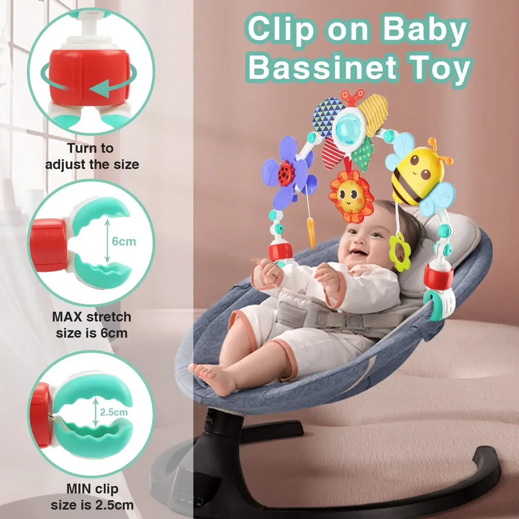 Colorful clip-on stroller arch toy with plush animal and flower designs featuring red and teal plastic components