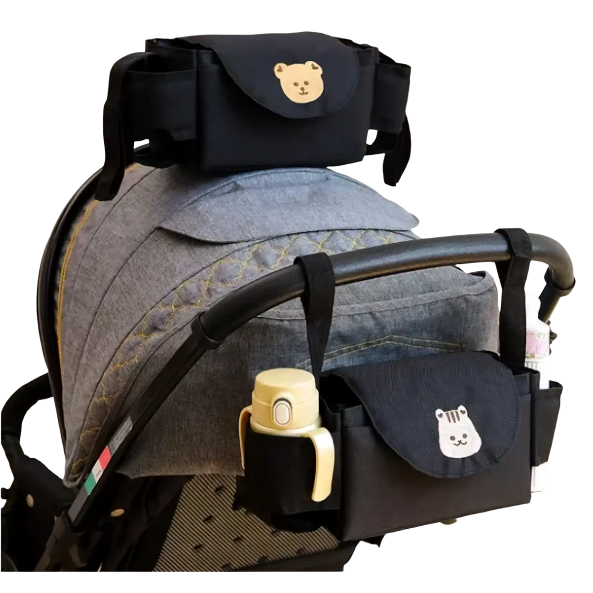 Black stroller organizer bag with embroidered bear faces on pockets for convenient baby accessory storage