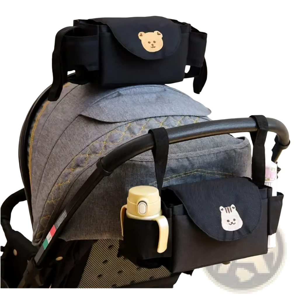 Black stroller organizer bag with embroidered bear faces on pockets for convenient baby accessory storage