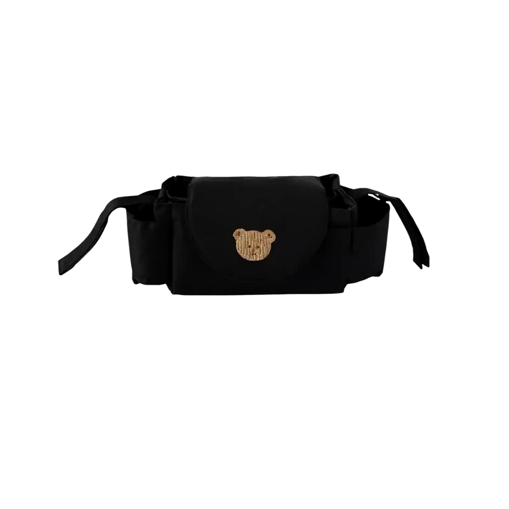 Black fabric stroller organizer bag with gold sequined bear face emblem designed for convenient baby item storage